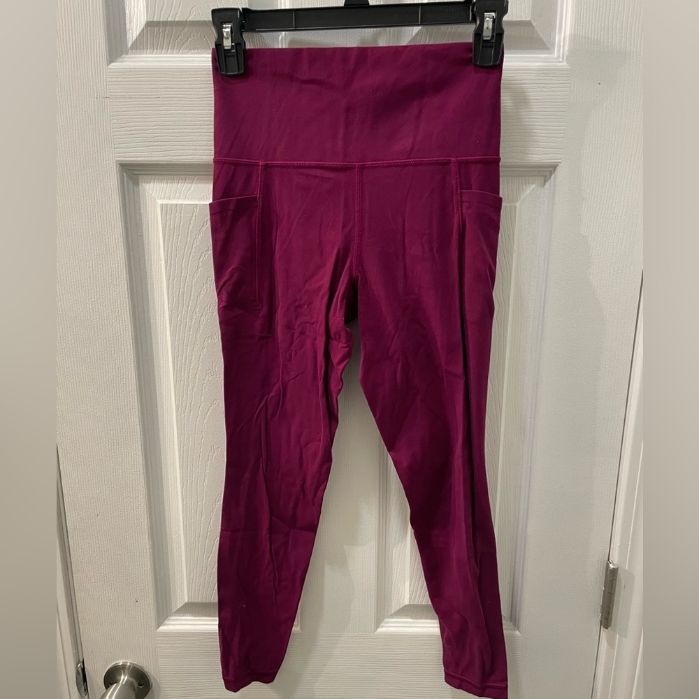 Athleta magenta 7/8 salutation tight in power it's, size xs
